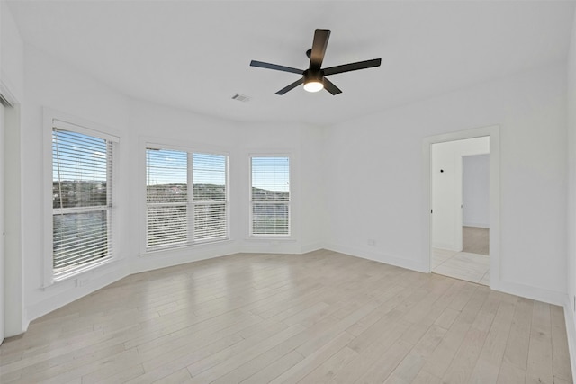 7905 Brightman Ln, Austin, TX 78733 - unfurnished room with a ceiling fan, plenty of natural light, and light wood finished floors