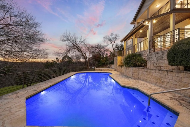 view of swimming pool with a fenced in pool