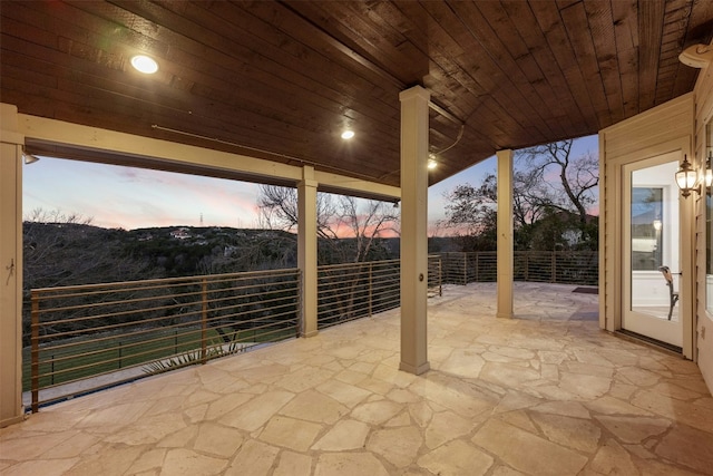 view of patio terrace at dusk