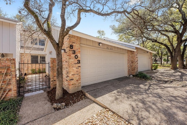 garage featuring driveway