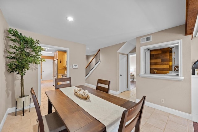 dining space featuring recessed lighting, visible vents, light tile patterned flooring, baseboards, and stairs