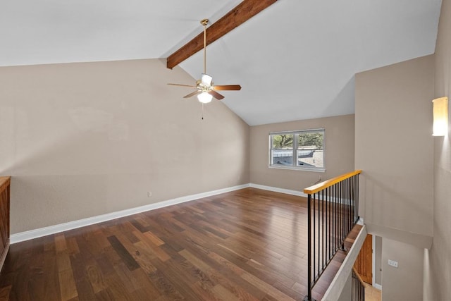 interior space with vaulted ceiling with beams, ceiling fan, wood finished floors, and baseboards