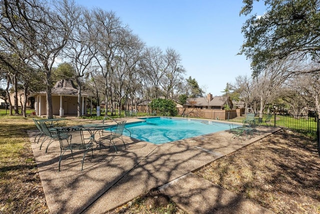 view of pool with a patio area, fence, and a fenced in pool