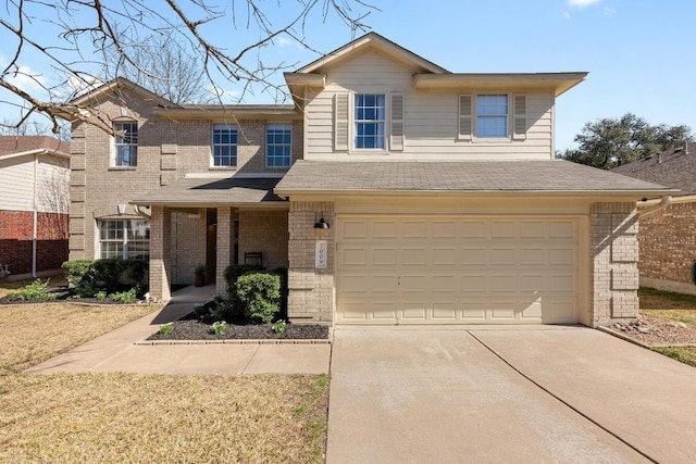 view of front of home featuring an attached garage, a shingled roof, concrete driveway, and brick siding