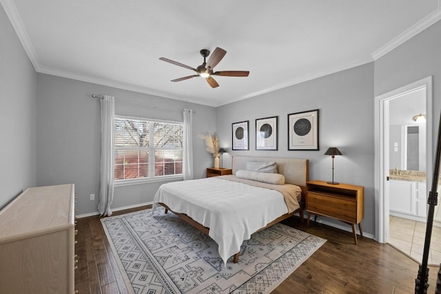 bedroom with ornamental molding, hardwood / wood-style flooring, and baseboards