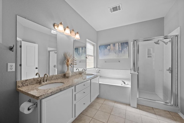 full bathroom with a stall shower, visible vents, a sink, and tile patterned floors