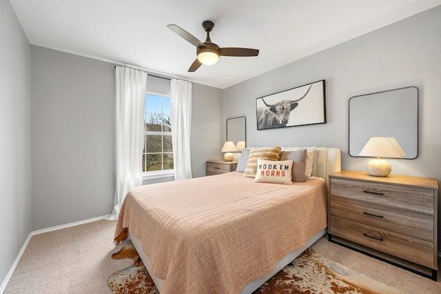 bedroom featuring carpet floors, baseboards, and a ceiling fan