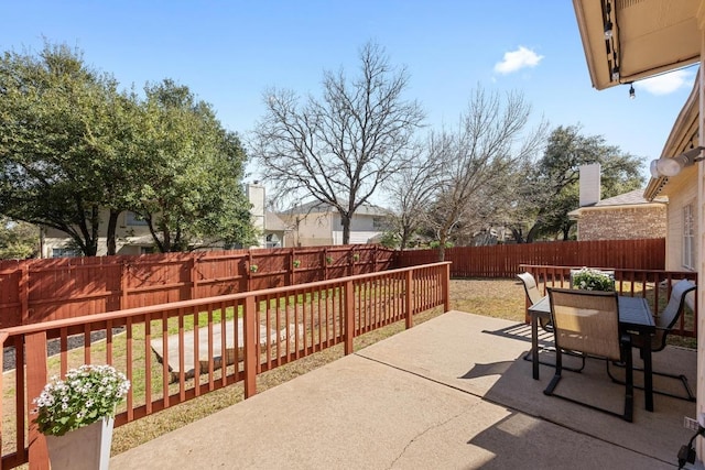 view of patio / terrace with outdoor dining space and a fenced backyard