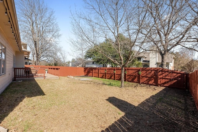 view of yard with a fenced backyard