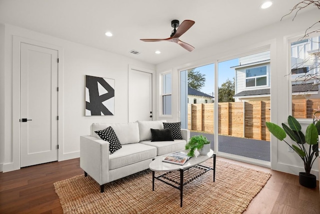 living room featuring wood finished floors, recessed lighting, a ceiling fan, and baseboards