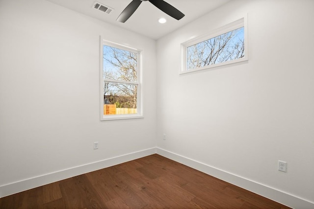 unfurnished room featuring baseboards, plenty of natural light, a ceiling fan, dark wood-style floors, and recessed lighting