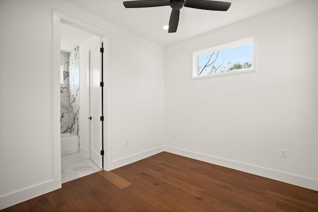 spare room with baseboards, a ceiling fan, wood finished floors, and recessed lighting
