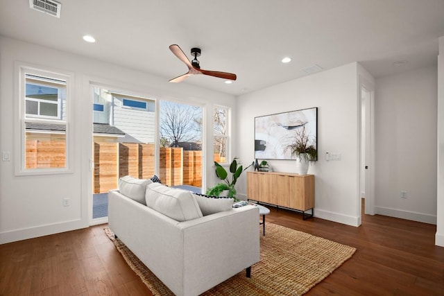 living room with baseboards, a ceiling fan, wood finished floors, and recessed lighting