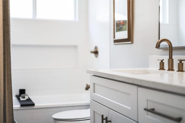 full bath with vanity and toilet