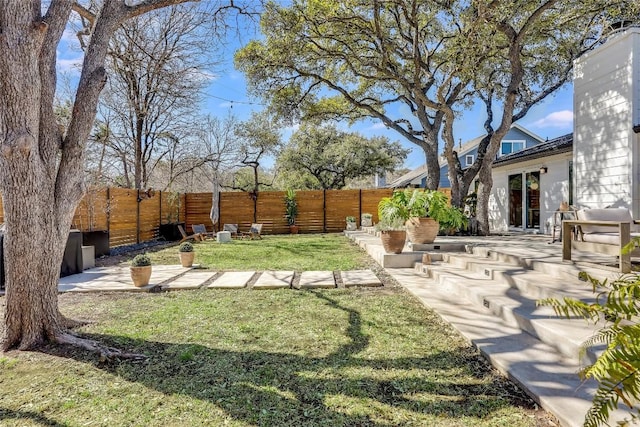 view of yard with fence private yard and a patio area