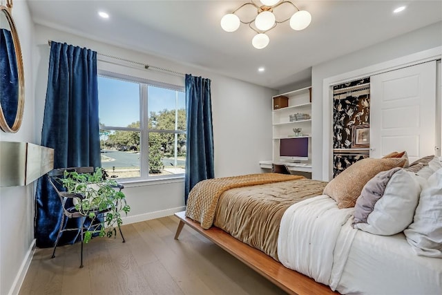 bedroom featuring recessed lighting, wood finished floors, and baseboards