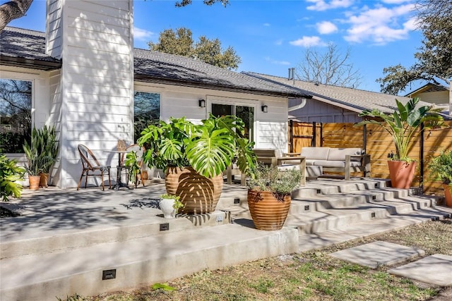 view of patio / terrace with fence and an outdoor hangout area