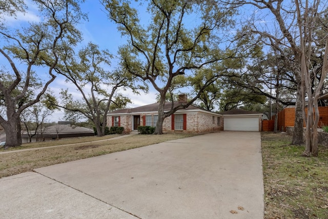 single story home with driveway, a garage, a chimney, and fence