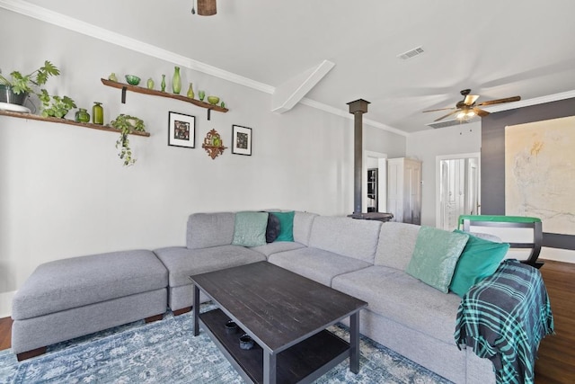 living room featuring crown molding, wood finished floors, visible vents, and a ceiling fan