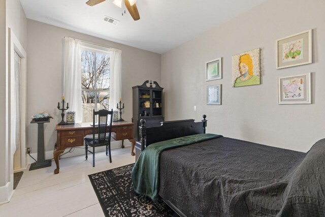 bedroom featuring baseboards, visible vents, and a ceiling fan