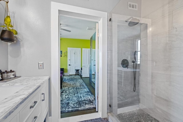 full bathroom with visible vents, vanity, and a walk in shower