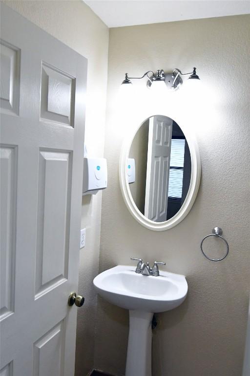 bathroom with a textured wall