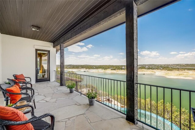 1208 Watercliffe Dr, Lago Vista, TX 78645 - balcony featuring a sunroom and a water view