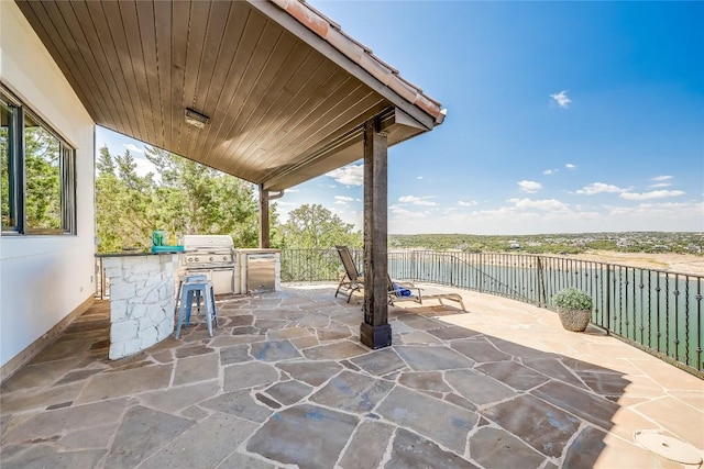 1208 Watercliffe Dr, Lago Vista, TX 78645 - view of patio featuring a grill and an outdoor kitchen