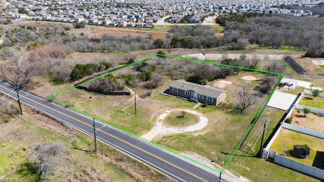 birds eye view of property with a residential view