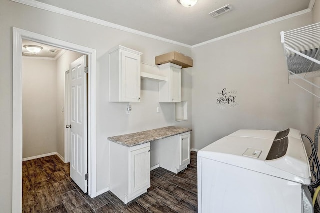 clothes washing area with dark wood-style flooring, visible vents, cabinet space, ornamental molding, and washer and dryer