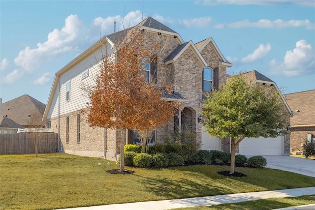 view of front of property featuring a garage, brick siding, a front yard, and fence