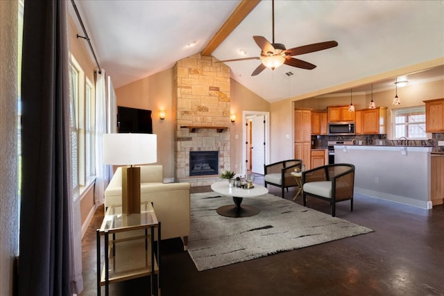 living room with visible vents, a ceiling fan, a stone fireplace, concrete flooring, and beamed ceiling