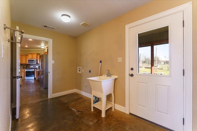 clothes washing area with laundry area, washer hookup, visible vents, baseboards, and electric dryer hookup