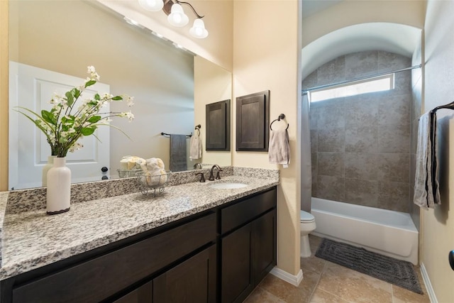 bathroom with washtub / shower combination, baseboards, vanity, and toilet