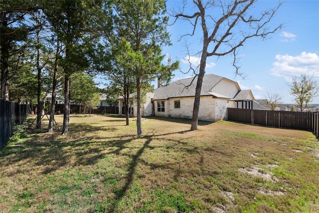 view of yard with a fenced backyard