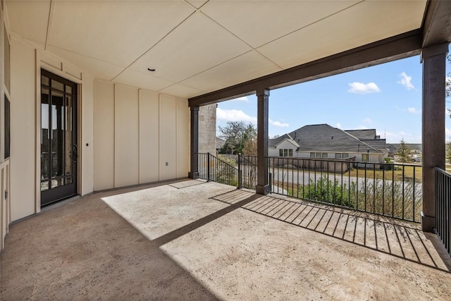 exterior space featuring a balcony and a residential view