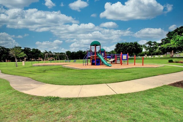 114 Darst Ln, Bastrop, TX 78602 - communal playground featuring a lawn