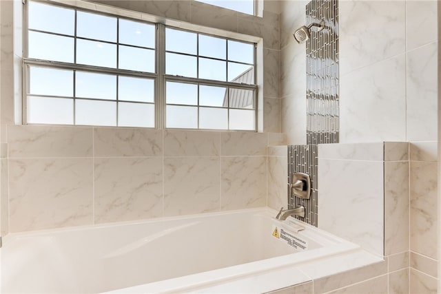 full bathroom featuring tiled shower / bath combo