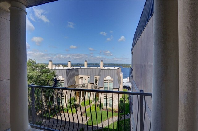 balcony featuring a water view