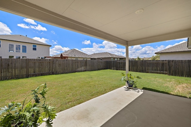 view of yard featuring a patio area and a fenced backyard