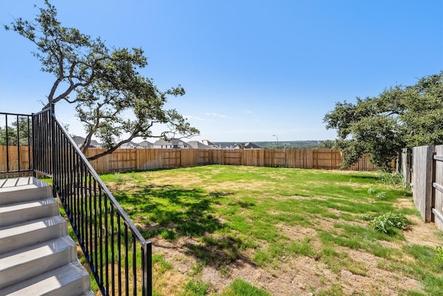 view of yard featuring a fenced backyard