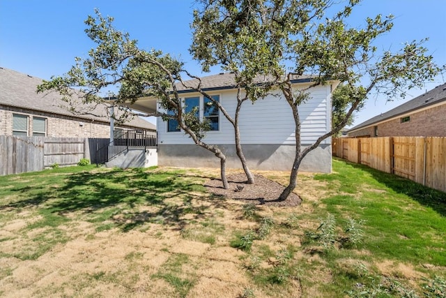 view of yard with a fenced backyard