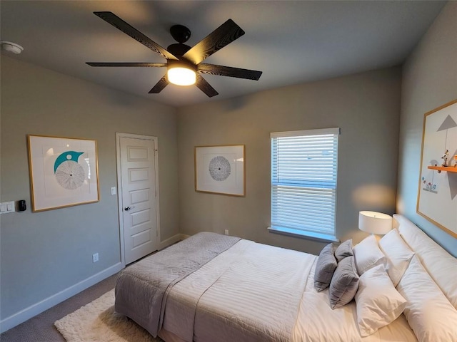 bedroom with carpet, baseboards, and a ceiling fan