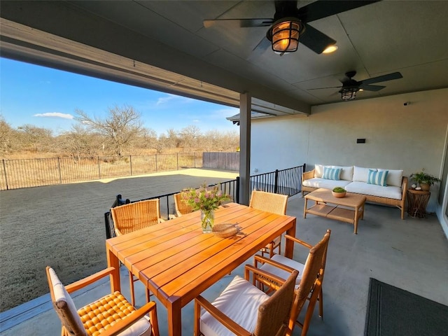 view of patio / terrace with outdoor dining area, a fenced backyard, an outdoor living space, and a ceiling fan