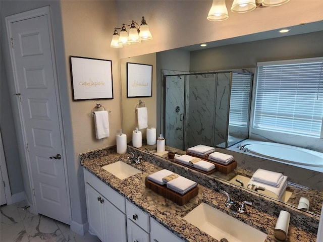 bathroom with a bath, marble finish floor, a marble finish shower, and a sink