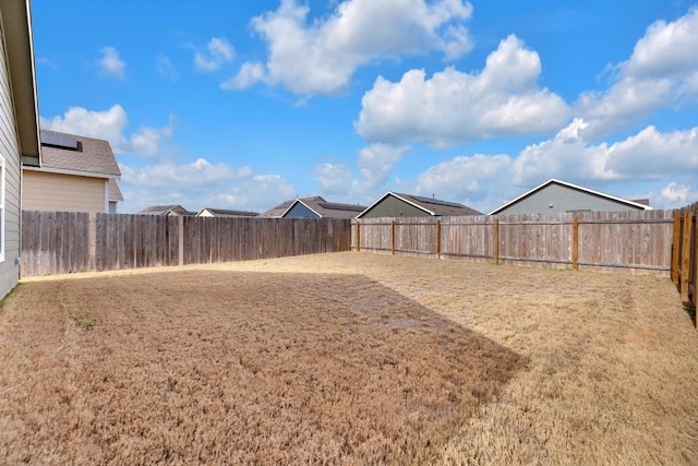 view of yard with a fenced backyard