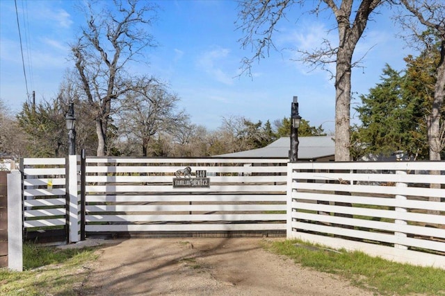 view of gate with fence