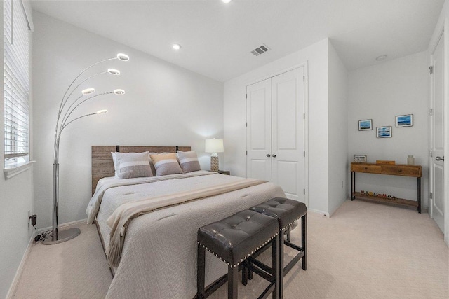 bedroom featuring recessed lighting, light carpet, visible vents, baseboards, and a closet