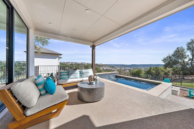 exterior space with a jacuzzi, fence, an outdoor living space, and a fenced in pool