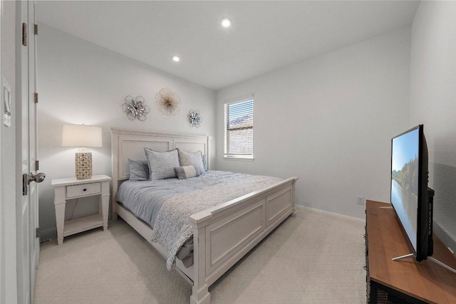 bedroom with recessed lighting, light colored carpet, and baseboards